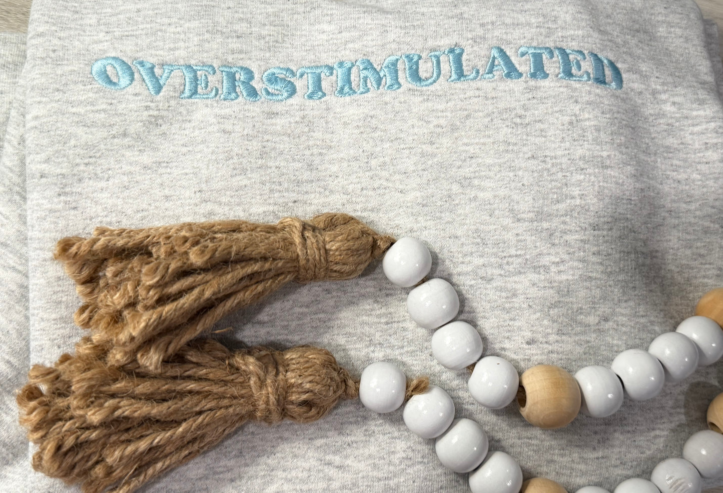 Embroidered overstimulated crewneck